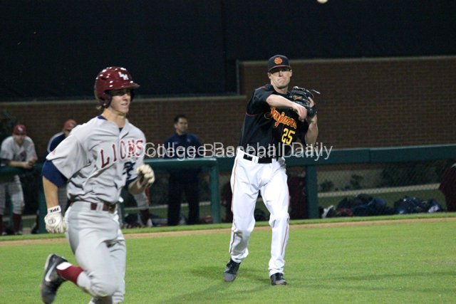 Brent Wheatley throws to first base.