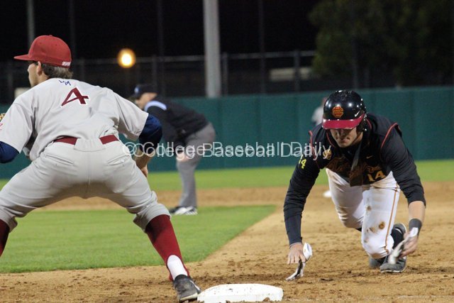 Vahn Bozoian dives back to first base.