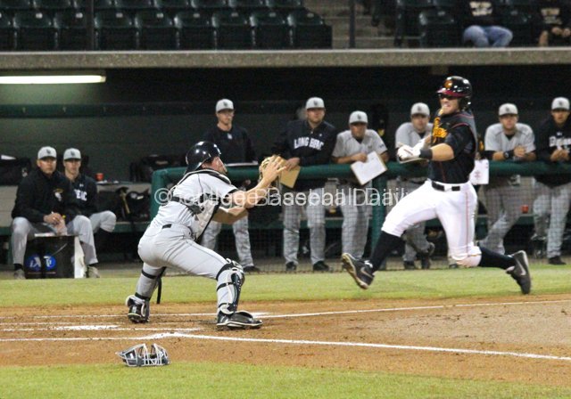 Eric Hutting catches Brenner's throw.