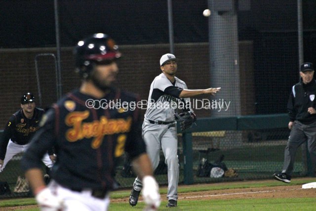Juan Avila throws out a run.
