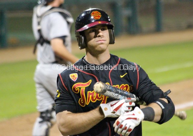 Greg Zebrack walks back to the dugout after striking out.