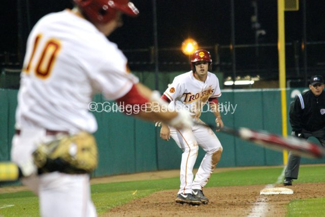 James Roberts leads off third base.