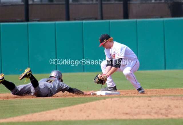 Adam Landecker tries to apply the tag.