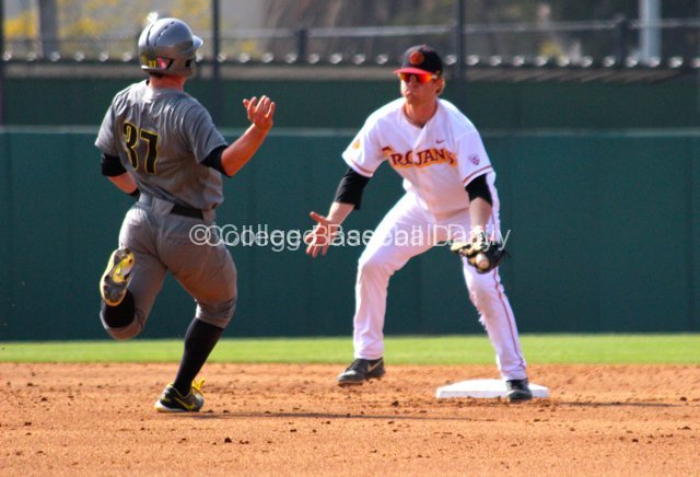 Adam Landecker waits to tag out Mitchell Tolman.
