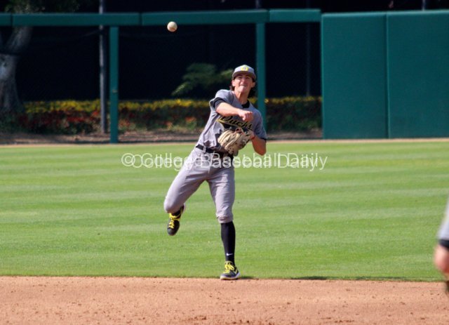 Aaron Payne throws to first.