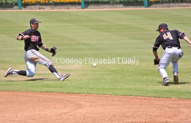 Oregon State's middle infielders try to cut off a bouncing grounder.