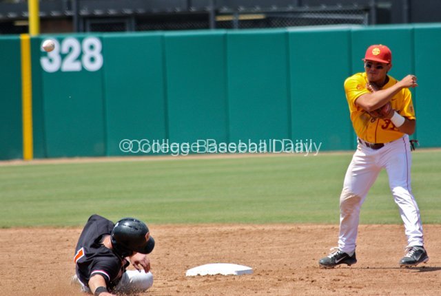 Andres Rodriguez turns a double play.