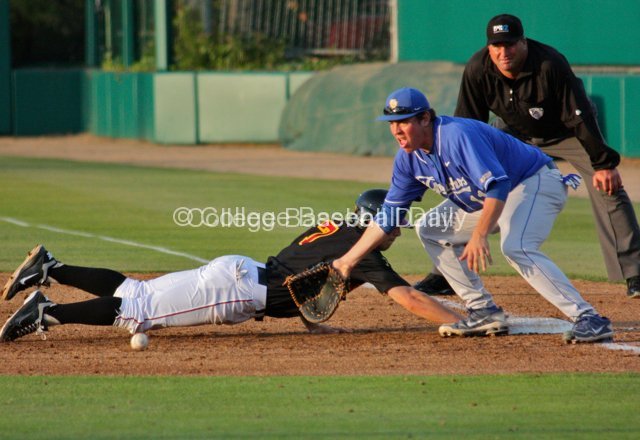 Greg Mahle goes to catch a bounced pickoff attempt.
