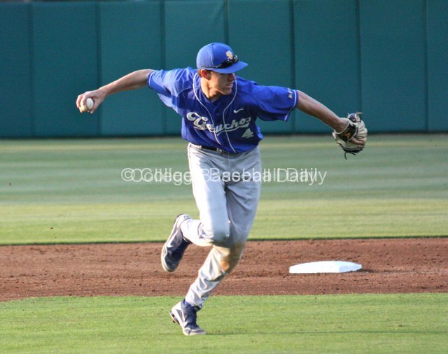 Steven Moon throws to first.