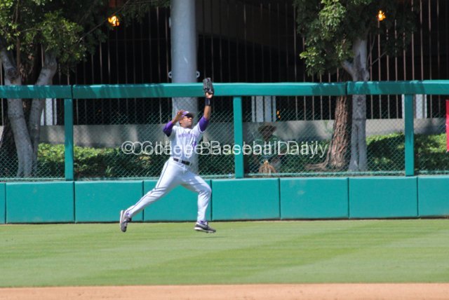 Caleb Brown lunges to catch a liner to RF.