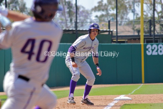 Jacob Lamb watches Joe Meggs hit a grounder.