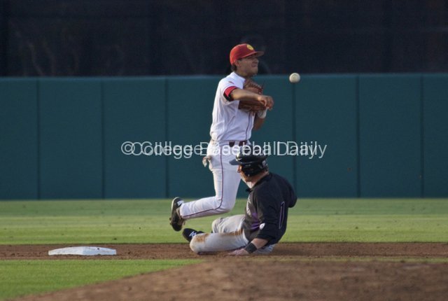 Andres Rodriguez turns the double play.