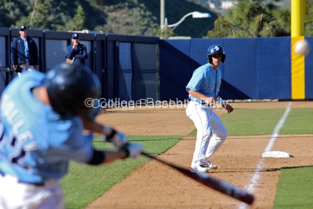 Austin Bailey watches Chris Woolley hit a sac fly.